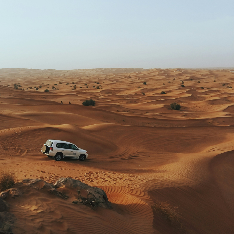 Desert landscape with vehicle